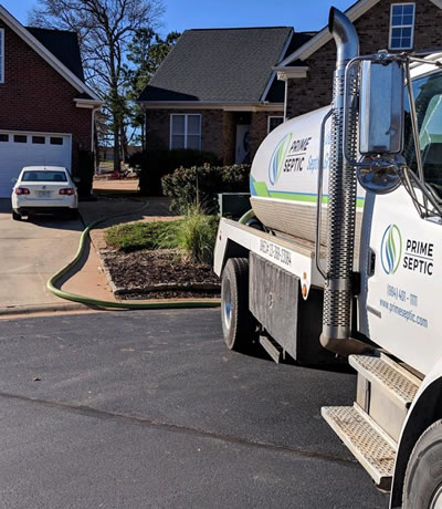 Prime Septic Truck Parked On Street While Pumping A Customers Septic Tank In Pelzer, South Carolina.