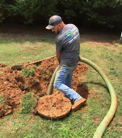 Prime Septic Driver Pumping A Septic Tank In Pelzer, South Carolina.