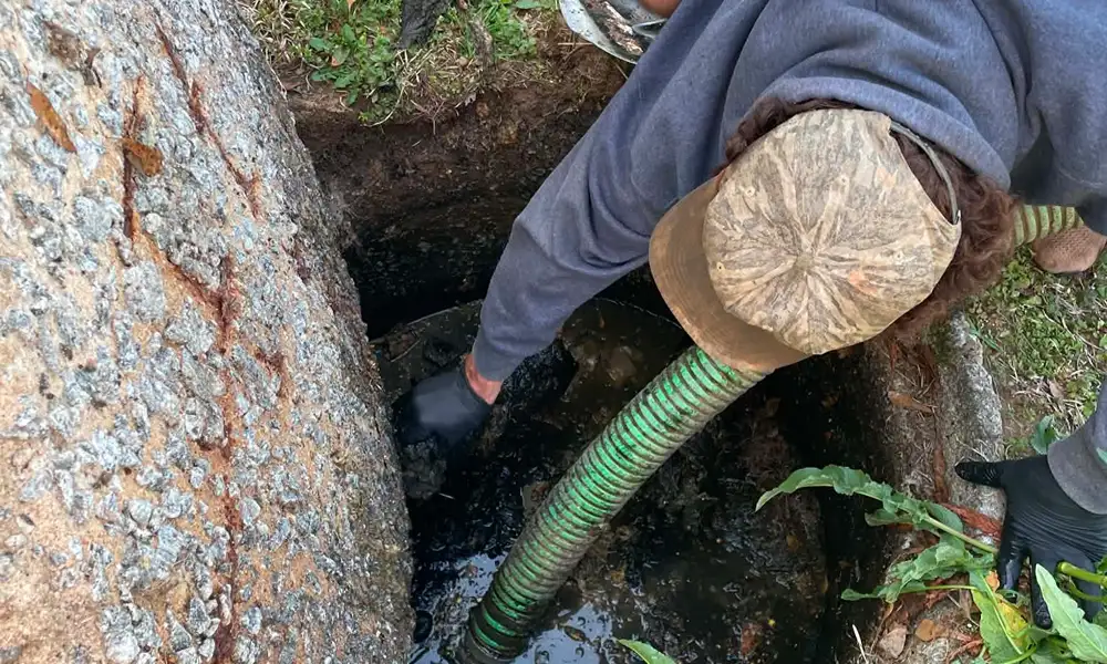 Septic Pumping Technician pumping a septic tank in Belton, SC.